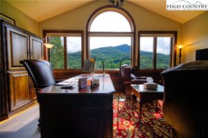 a study in an Ashe County home with beautiful windows overlooking the mountains